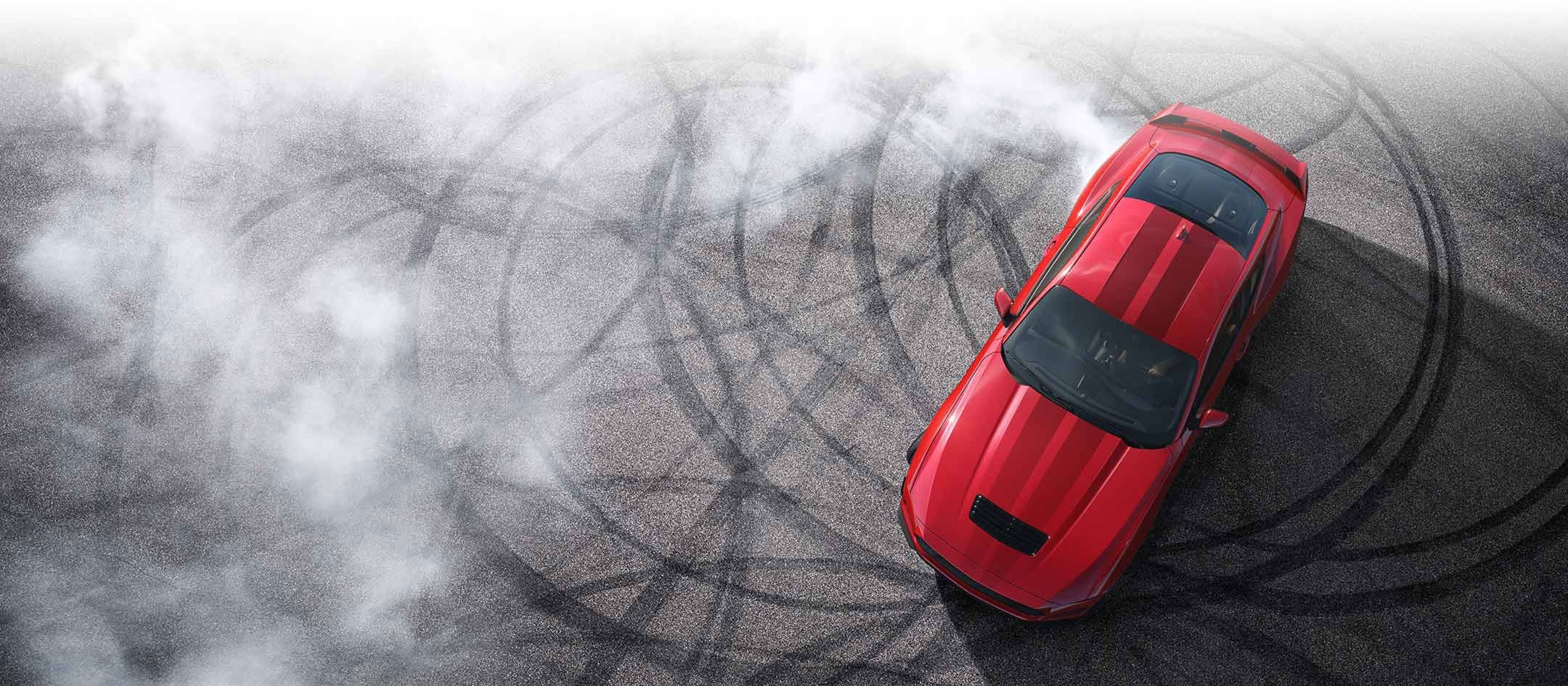 Overhead view of a 2024 Ford Mustang® model with tire tracks on pavement | Zook Motors in Kane PA